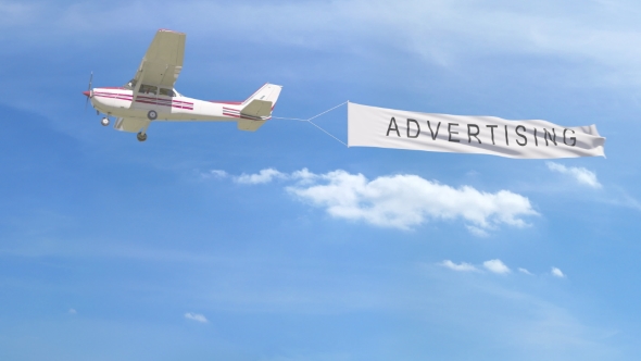 plane flying aerial advertising over Philadelphia